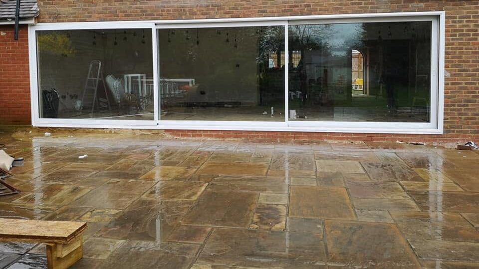 White uPVC 2-panel patio sliding doors open to garden patio