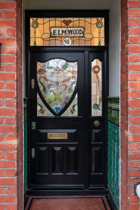 Black traditional Victorian door close up