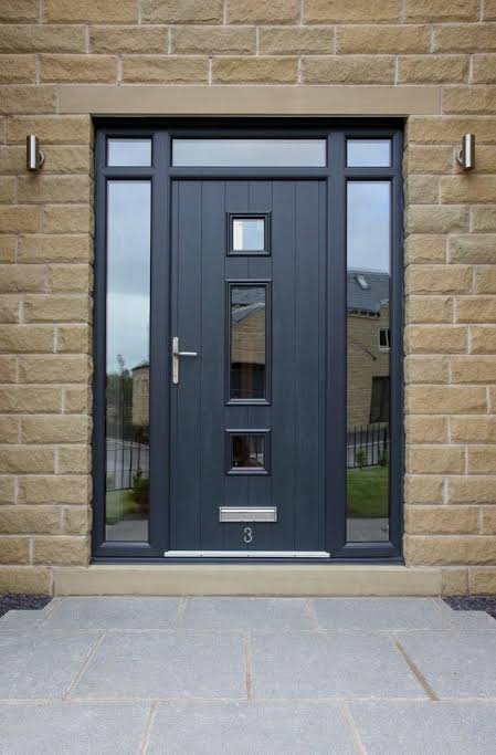 Composite door with side panels and top light