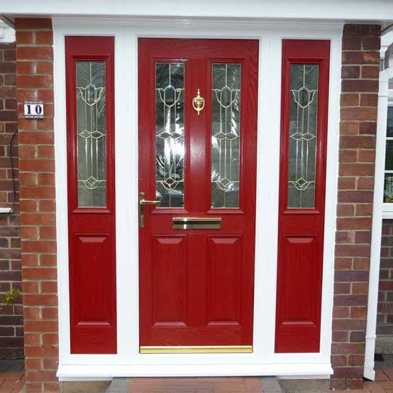 Traditional red composite door with decorative glass
