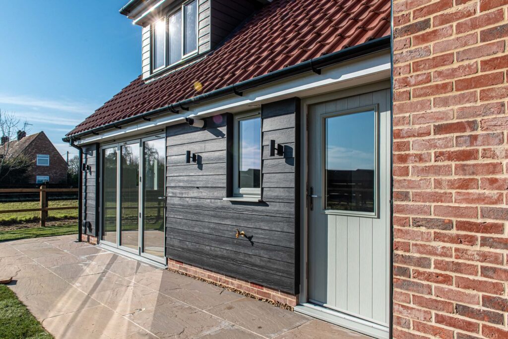 New build home with matching composite front door and aluminium bi-folds