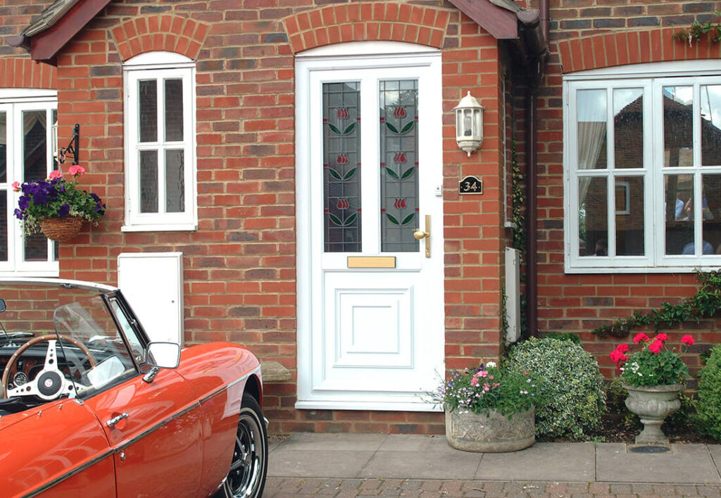 White uPVC front entrance door in brick home
