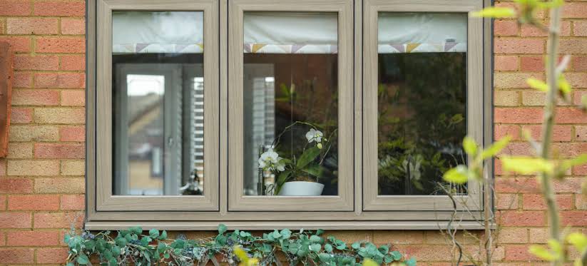 White uPVC casement window in brick home