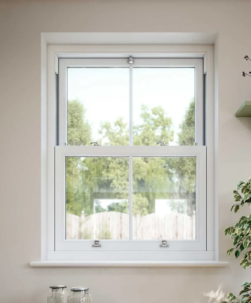 uPVC White Sliding Sash Window with Georgian Bars in Brick Wall